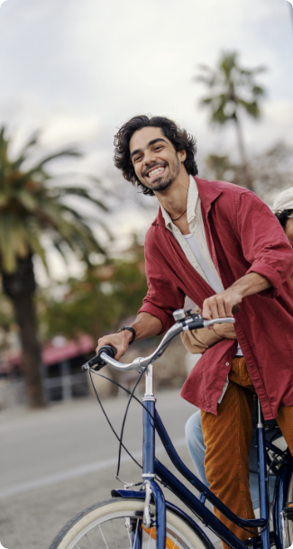 happy-couple-having-fun-with-bike-during-their-trip-spain